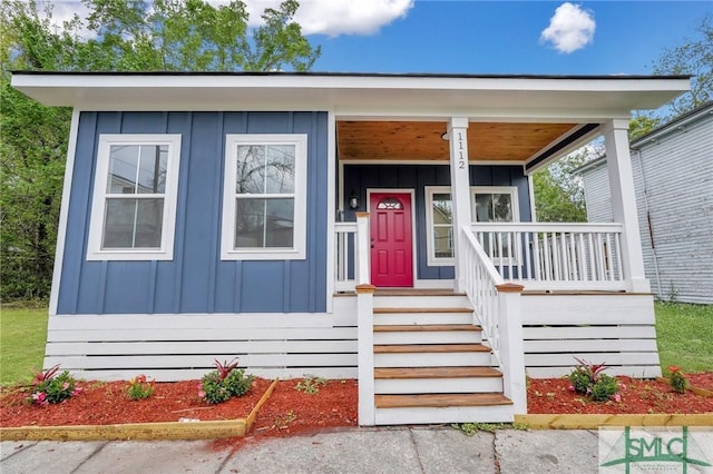 view of front of property featuring board and batten siding and covered porch