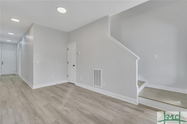 interior space with light wood-style flooring, stairs, recessed lighting, baseboards, and visible vents