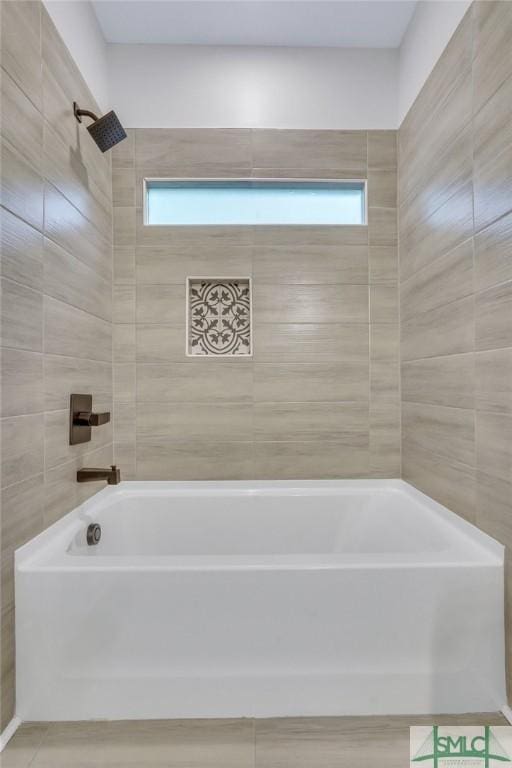bathroom featuring shower / bath combination and plenty of natural light