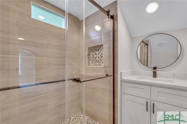 full bathroom featuring vanity and a stall shower