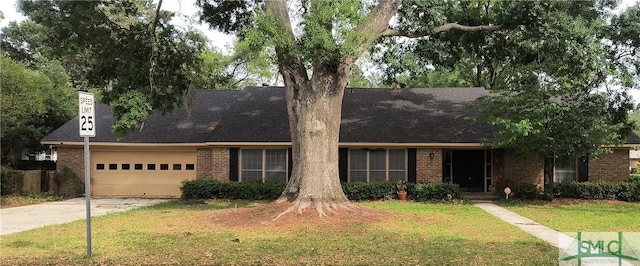 view of front of property featuring a shingled roof, brick siding, a garage, a front yard, and concrete driveway