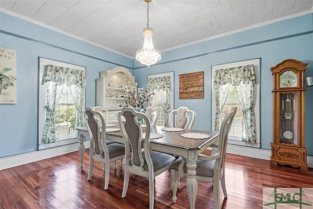 219 N College St, Pembroke, GA 31321 - dining area with a notable chandelier, plenty of natural light, ornamental molding, and wood finished floors