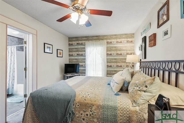 219 N College St, Pembroke, GA 31321 - bedroom featuring a ceiling fan and an accent wall