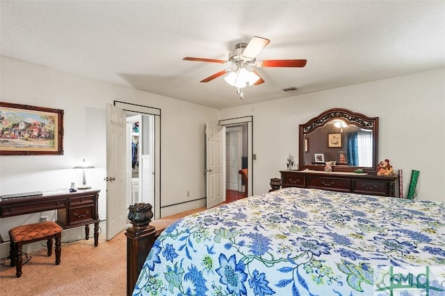 219 N College St, Pembroke, GA 31321 - bedroom featuring visible vents, ceiling fan, and light colored carpet