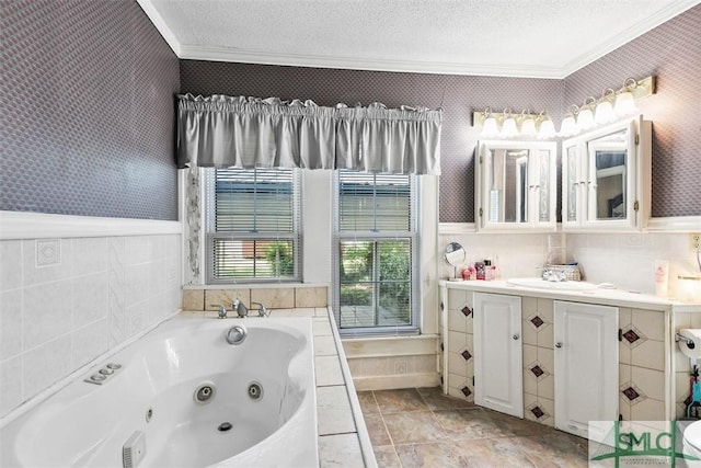 219 N College St, Pembroke, GA 31321 - full bathroom featuring crown molding, vanity, a tub with jets, and a textured ceiling