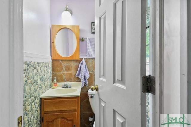 219 N College St, Pembroke, GA 31321 - bathroom with vanity and tasteful backsplash