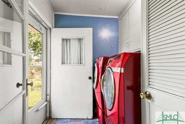 219 N College St, Pembroke, GA 31321 - laundry room featuring a textured ceiling, ornamental molding, independent washer and dryer, and cabinet space