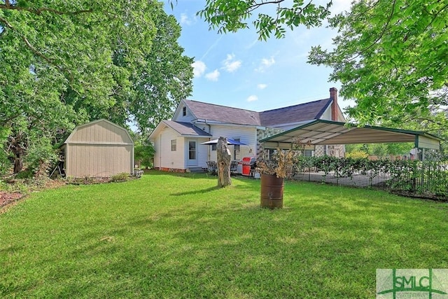 219 N College St, Pembroke, GA 31321 - view of yard featuring a shed and an outbuilding