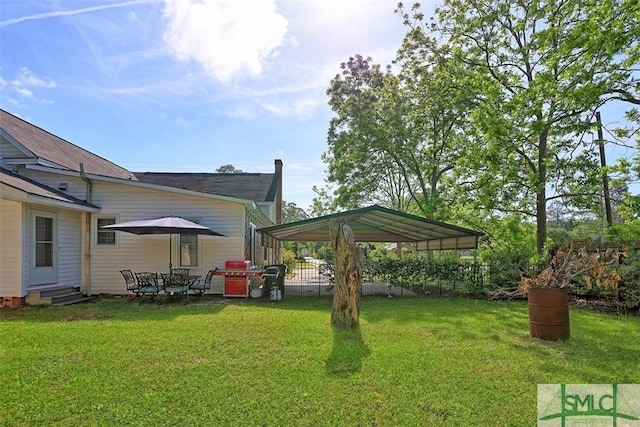 219 N College St, Pembroke, GA 31321 - view of yard featuring entry steps and a detached carport