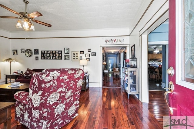 219 N College St, Pembroke, GA 31321 - living area with a ceiling fan, ornamental molding, and wood finished floors