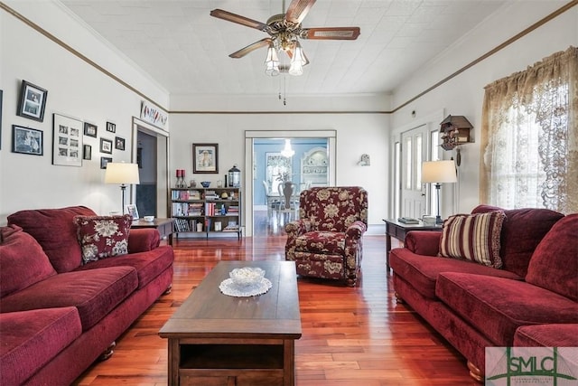 219 N College St, Pembroke, GA 31321 - living room with crown molding, a ceiling fan, and hardwood / wood-style flooring