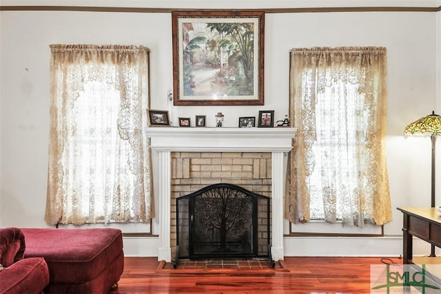 219 N College St, Pembroke, GA 31321 - living area with wood finished floors and a fireplace