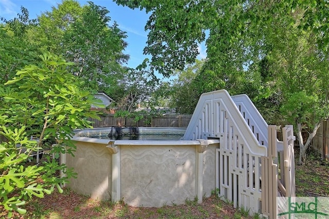 219 N College St, Pembroke, GA 31321 - view of storm shelter with a fenced backyard