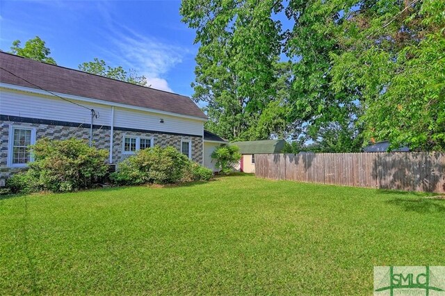 219 N College St, Pembroke, GA 31321 - view of yard featuring fence
