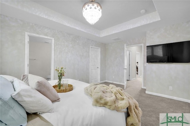 bedroom with baseboards and carpet floors