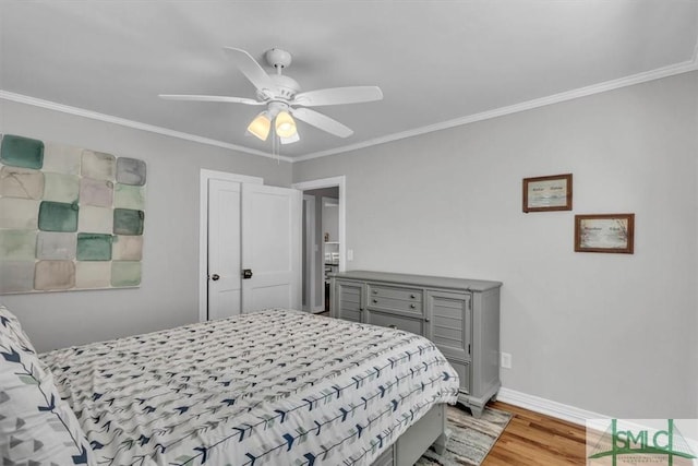 bedroom featuring baseboards, ceiling fan, ornamental molding, and light wood-style flooring