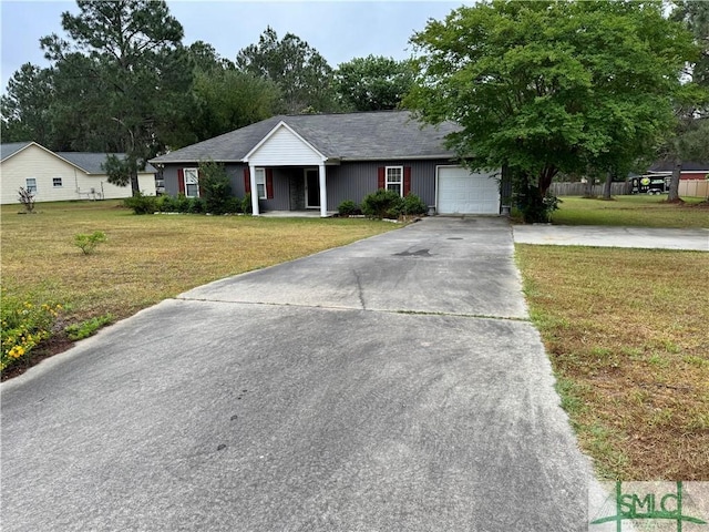 ranch-style house featuring an attached garage, concrete driveway, and a front lawn