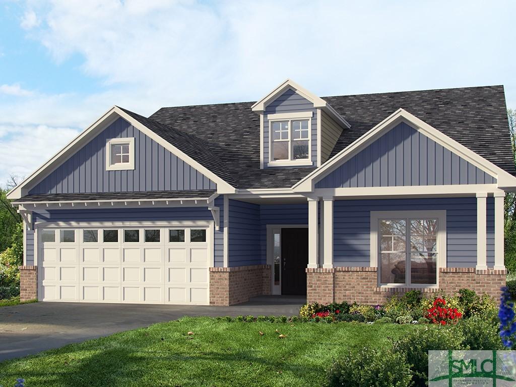 craftsman-style home with board and batten siding, brick siding, aphalt driveway, and a garage
