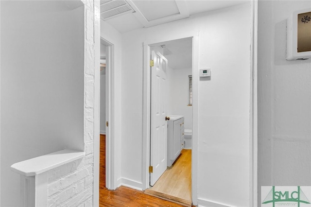 819 W 51st St, Savannah, GA 31405 - corridor featuring light wood-style flooring and attic access