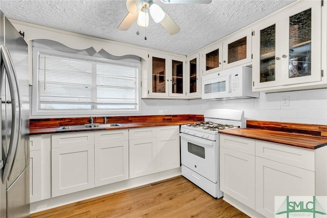 819 W 51st St, Savannah, GA 31405 - kitchen with white appliances, butcher block countertops, a sink, a textured ceiling, and a ceiling fan
