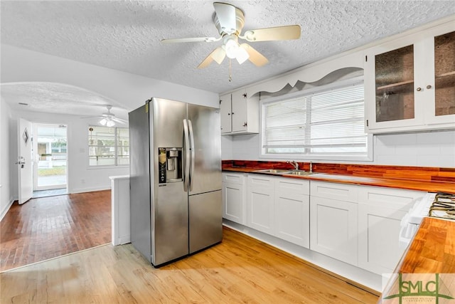 819 W 51st St, Savannah, GA 31405 - kitchen featuring stainless steel fridge, a ceiling fan, wood counters, light wood-style floors, and a textured ceiling