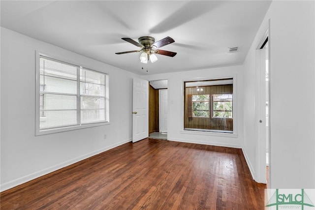 819 W 51st St, Savannah, GA 31405 - unfurnished room featuring dark wood-style flooring, baseboards, and a ceiling fan