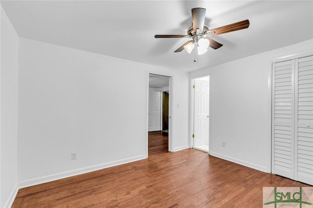 819 W 51st St, Savannah, GA 31405 - unfurnished bedroom featuring wood finished floors, baseboards, and ceiling fan