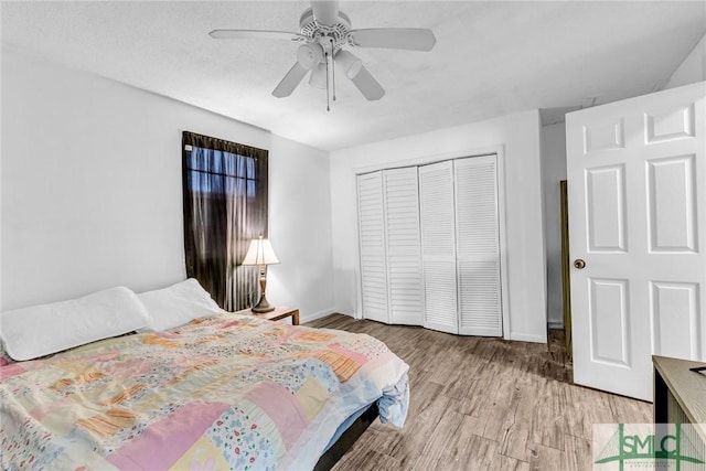 819 W 51st St, Savannah, GA 31405 - bedroom featuring a closet, light wood finished floors, baseboards, and ceiling fan