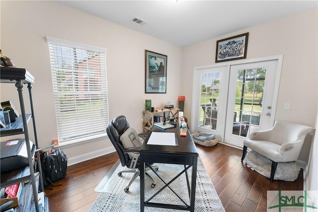 home office featuring baseboards, dark wood-style flooring, and visible vents