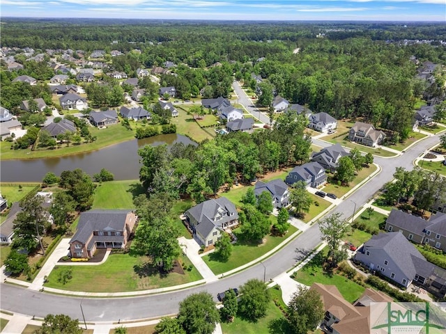 bird's eye view with a residential view, a water view, and a forest view