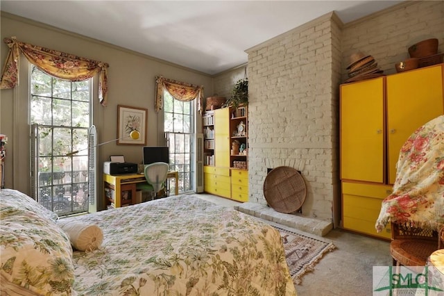 bedroom featuring crown molding and carpet