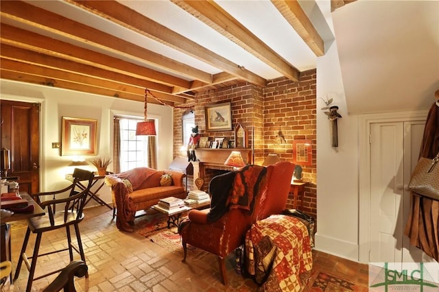 living room with beam ceiling and brick floor