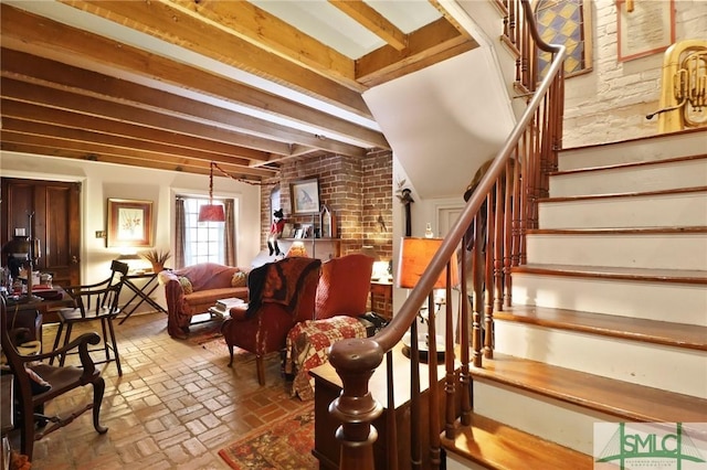 stairs featuring brick floor