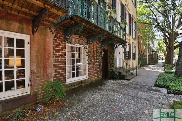 view of side of property with brick siding