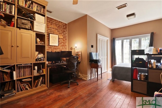 office area featuring visible vents and wood-type flooring