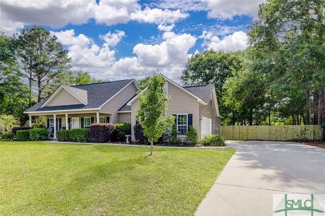 213 Rosehill Dr E, Rincon, GA 31326 - craftsman-style home with a front lawn, driveway, fence, and roof with shingles