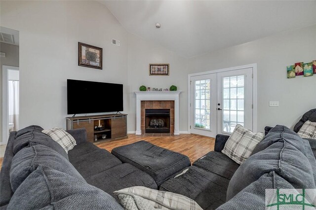213 Rosehill Dr E, Rincon, GA 31326 - living room featuring french doors, visible vents, baseboards, light wood-style floors, and lofted ceiling