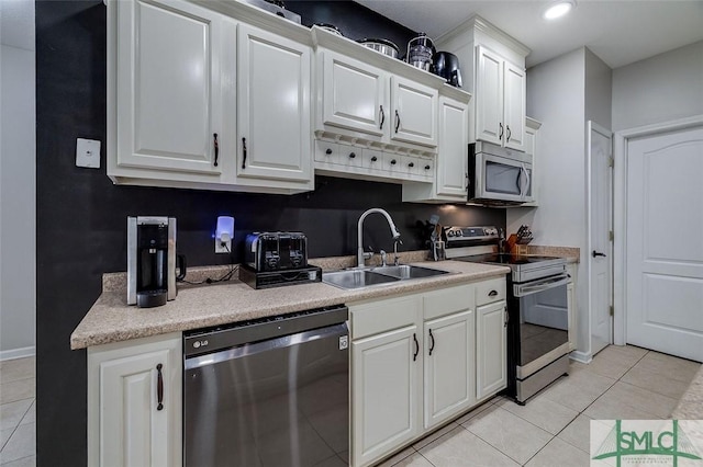 213 Rosehill Dr E, Rincon, GA 31326 - kitchen with a sink, white cabinetry, light countertops, appliances with stainless steel finishes, and light tile patterned flooring