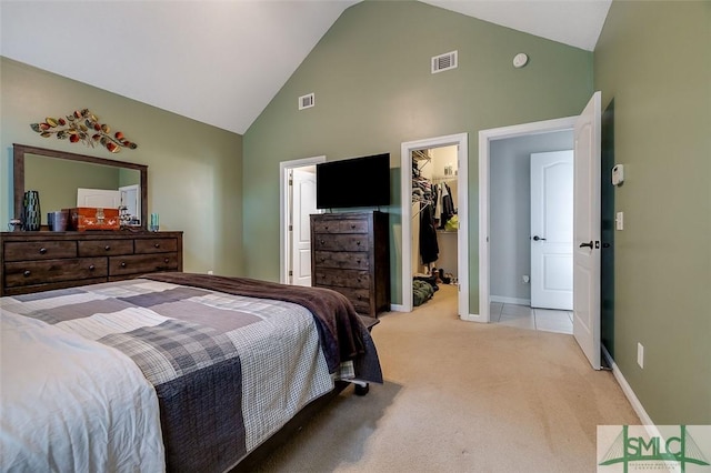 213 Rosehill Dr E, Rincon, GA 31326 - bedroom with a spacious closet, light carpet, visible vents, and high vaulted ceiling