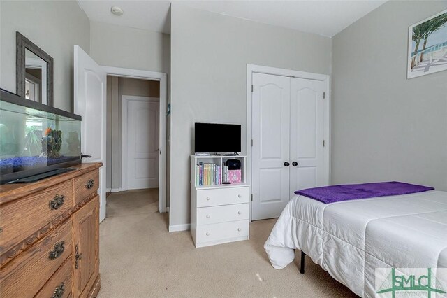 213 Rosehill Dr E, Rincon, GA 31326 - bedroom with light carpet, a closet, and baseboards
