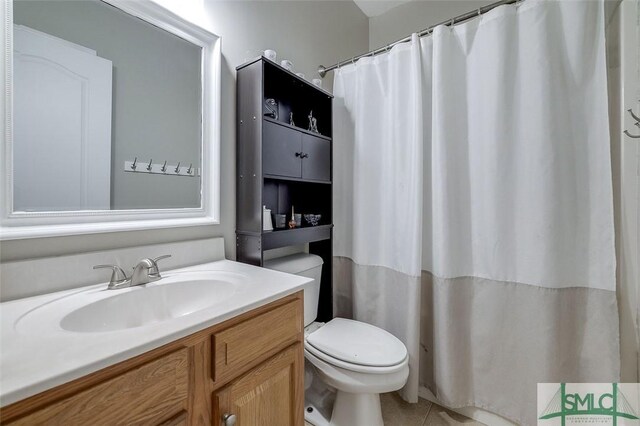 213 Rosehill Dr E, Rincon, GA 31326 - bathroom featuring toilet, tile patterned flooring, vanity, and curtained shower