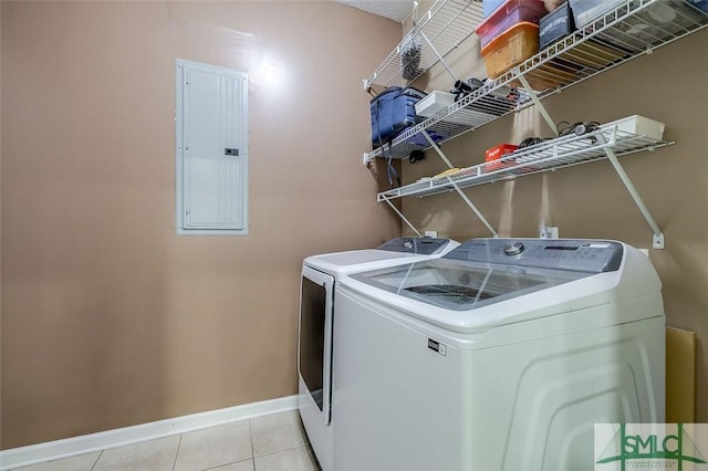 213 Rosehill Dr E, Rincon, GA 31326 - laundry area featuring electric panel, laundry area, washer and dryer, light tile patterned floors, and baseboards
