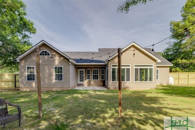 213 Rosehill Dr E, Rincon, GA 31326 - back of property with a yard, a shingled roof, and fence