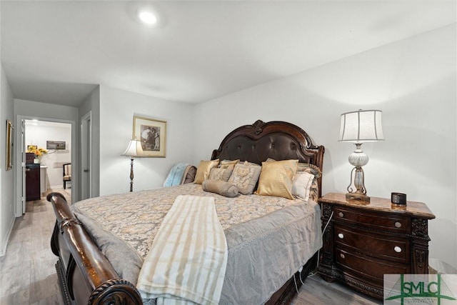 bedroom with wood finished floors