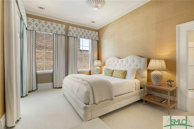 bedroom with carpet flooring, ornamental molding, visible vents, and wallpapered walls