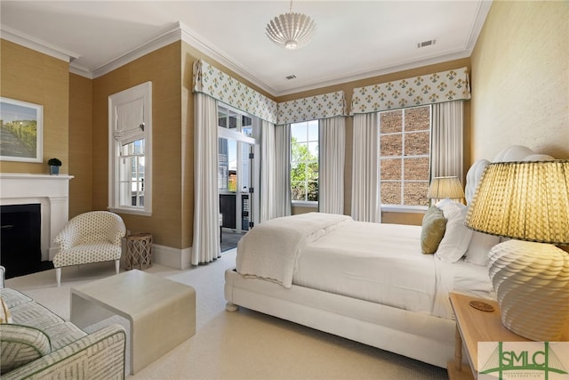 bedroom featuring access to outside, visible vents, a fireplace, and crown molding