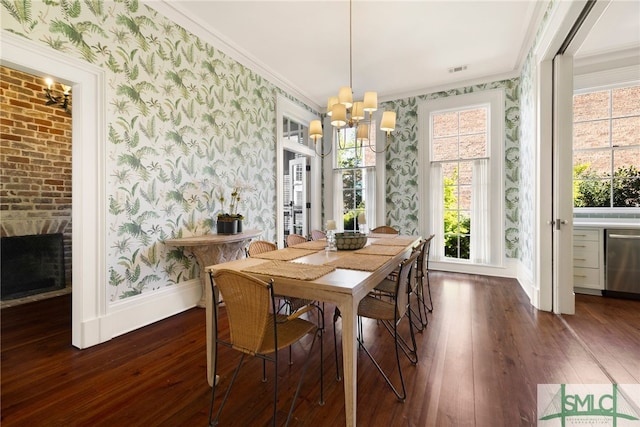dining area featuring wallpapered walls, hardwood / wood-style floors, and an inviting chandelier