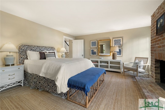 bedroom featuring a fireplace