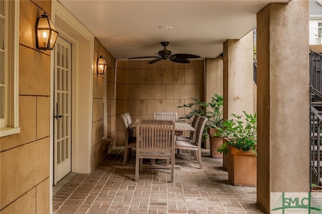 balcony with a patio area, a ceiling fan, and outdoor dining space