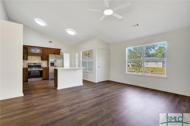 kitchen with dark wood-style flooring, light countertops, appliances with stainless steel finishes, and visible vents
